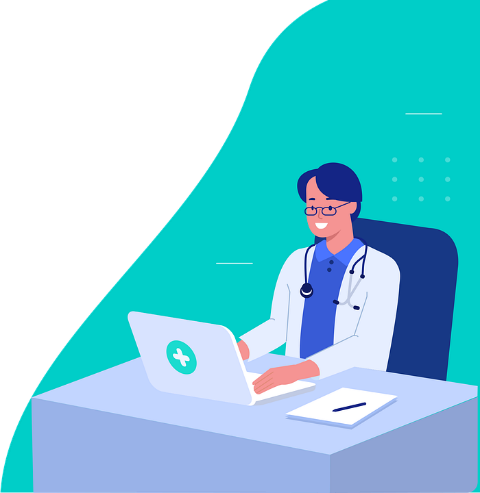 Lekarz w okularach siedzący za biurkiem, wpisuje coś w komputer